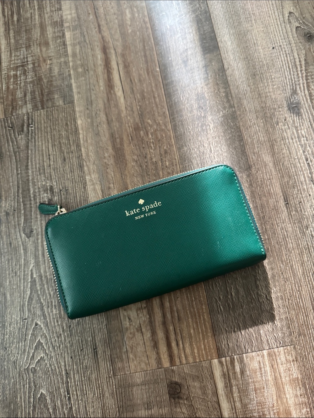 kate spade emerald green zip-around wallet with gold logo